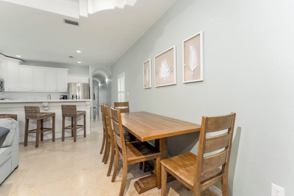 The dining space is conveniently perched between the living room and kitchen.