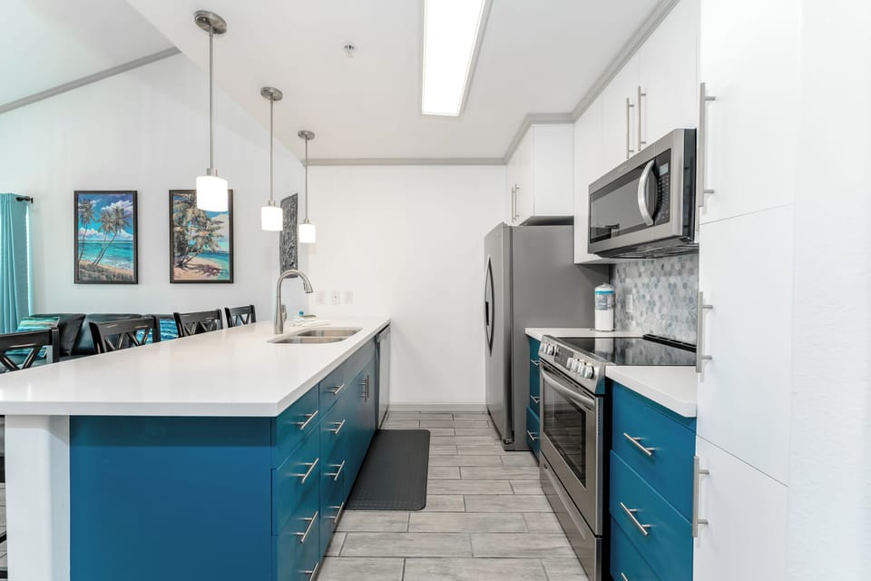 Our gorgeous kitchen is fully equipped with stainless appliances. Stock up fresh produce at the charming local grocery, Blue Marlin!