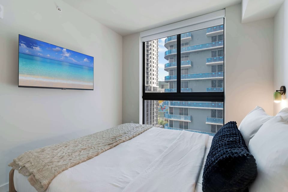 Guest bedroom with a queen size bed and a minimalist, calming aesthetic