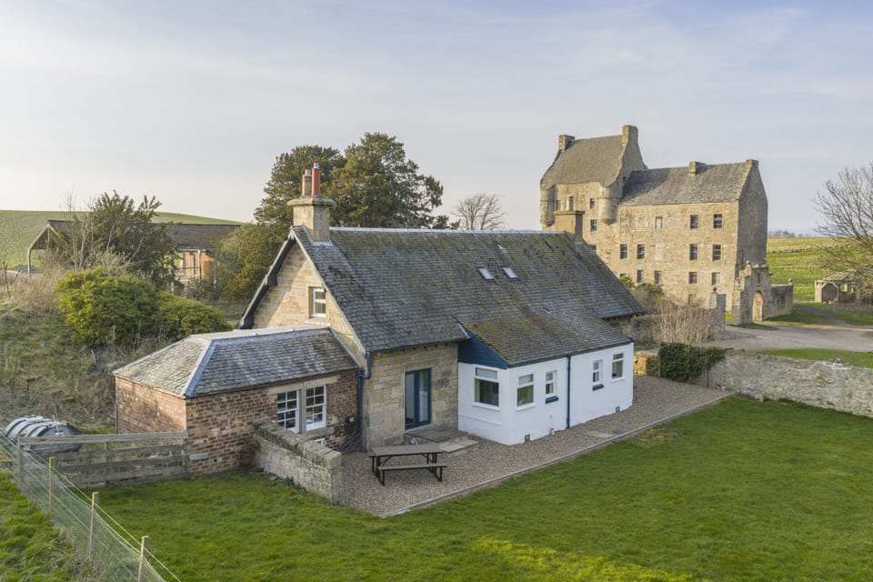 The charming Old Gamekeeper's Cottage offers a cozy retreat filled with rustic charm and timeless character, perfect for a peaceful countryside escape.