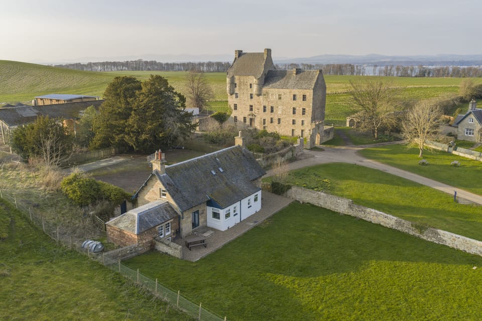 The charming Old Gamekeeper’s Cottage offers a cozy retreat nestled in scenic surroundings, perfect for a peaceful getaway.