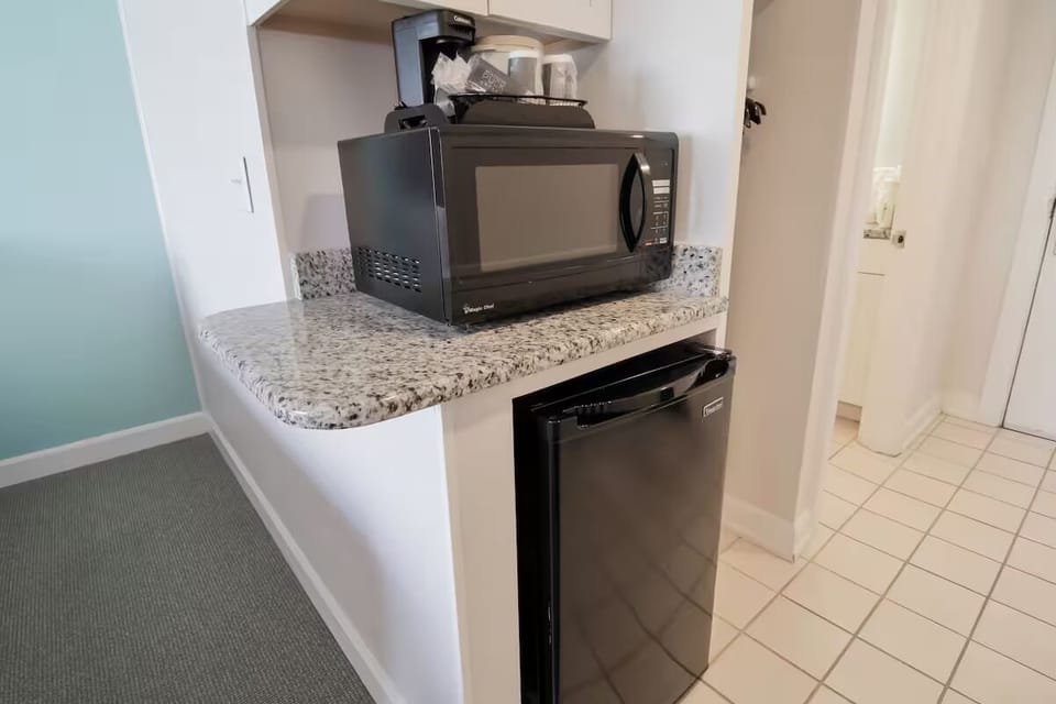 Unpack snacks and chill drinks in your in-room kitchenette.