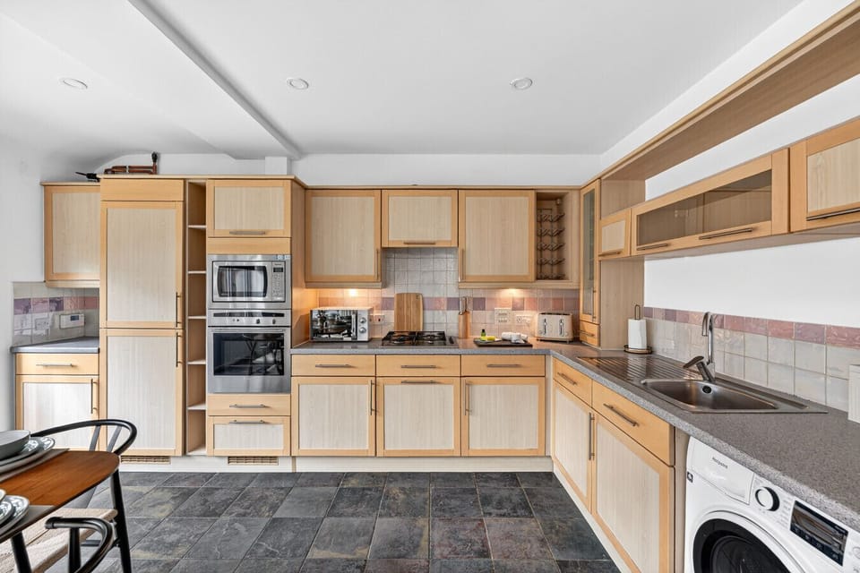 A fully equipped kitchen, complete with everything you need to prepare a home-cooked meal.