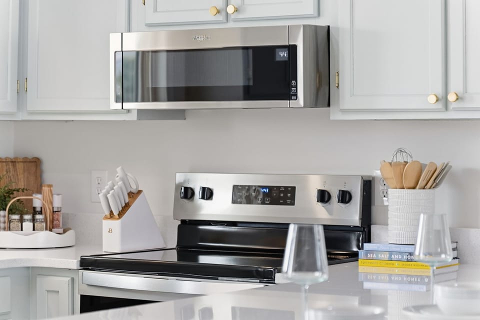 Sleek stainless steel kitchen appliances including microwave, stove, oven, and range—perfect for cooking with ease while enjoying a modern, upgraded kitchen space.