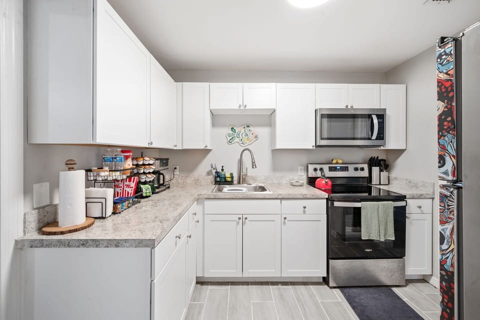 Bright modern kitchen with stainless appliances and ample counter space