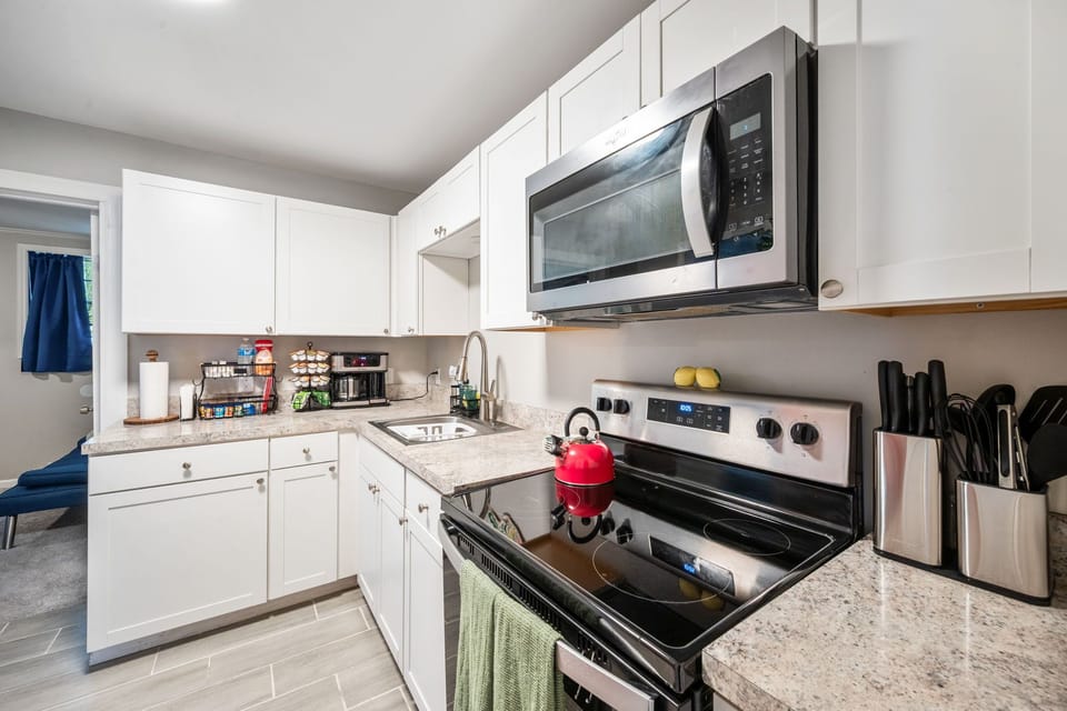 Bright modern kitchen with stainless appliances and ample prep space
