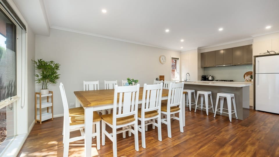 Spacious dining table with seating for ten people 