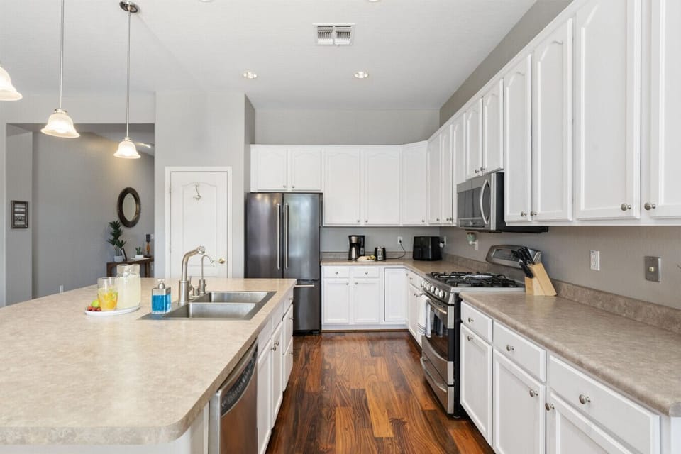 Kitchen | Stainless Steel Appliances | Cabinet Storage & Countertop Workspace