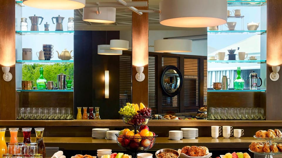 Start your morning with a colorful breakfast spread and fresh coffee.