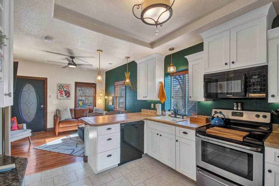 Kitchen and living room, open concept. Fully stocked with new appliances.