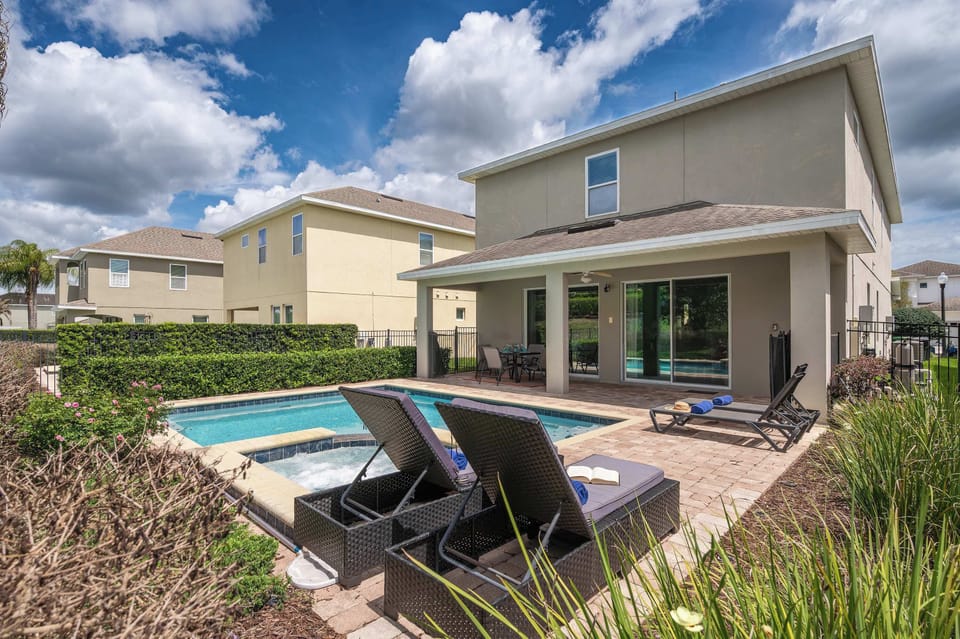 Relax by the private pool and spa in this modern backyard retreat.