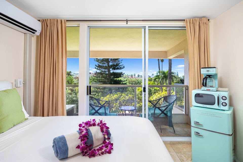 This unit provides access to the balcony with convenient glass doors, also allowing direct view of the calm nature outside. Enjoy the view while on bed or step out and soak in the serene gust of nature.