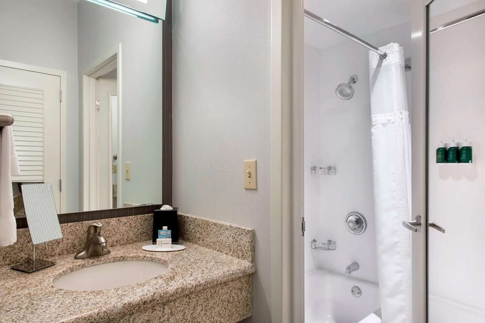 Refresh easily with bright vanity space and a hot shower.