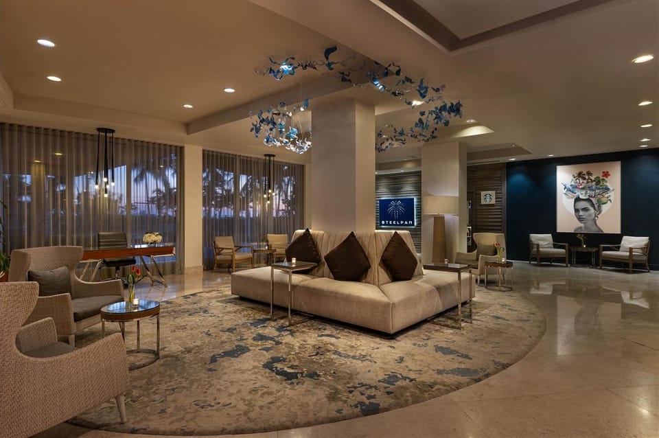 Relax in the polished lobby with plush seating and warm lighting.