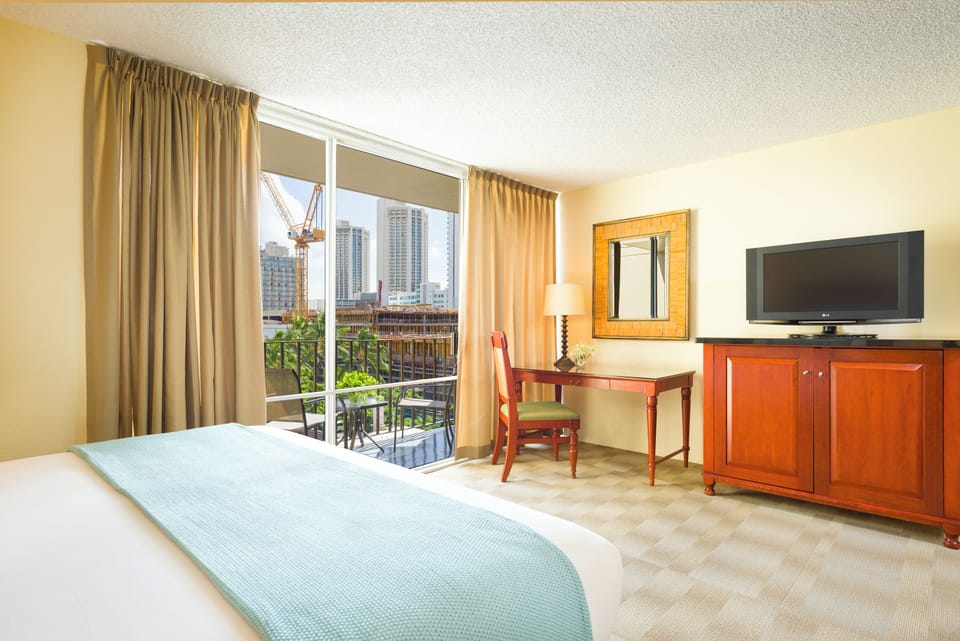 Wake up to sunshine and skyline views from your balcony.