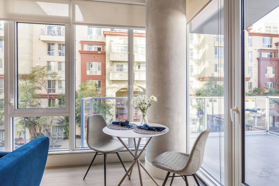 Enjoy an intimate meal by floor-to-ceiling windows that bring the neighborhood’s energy inside.