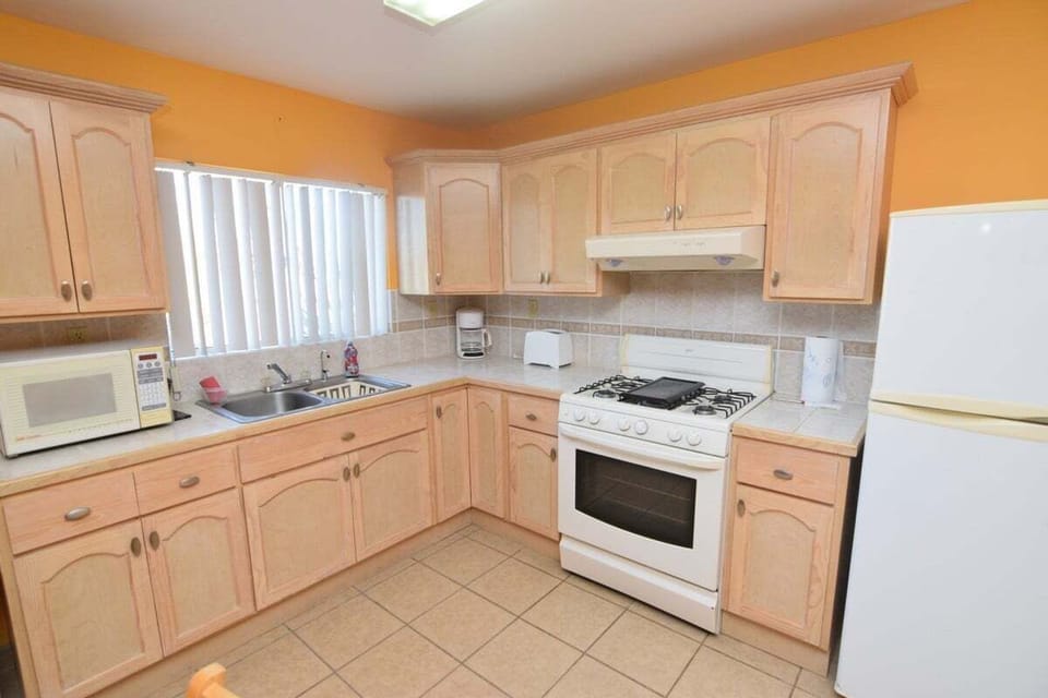 Cook with ease in the full kitchen of Casa del Sol in El Dorado Ranch San Felipe Baja California — stove, fridge, and counter space included.