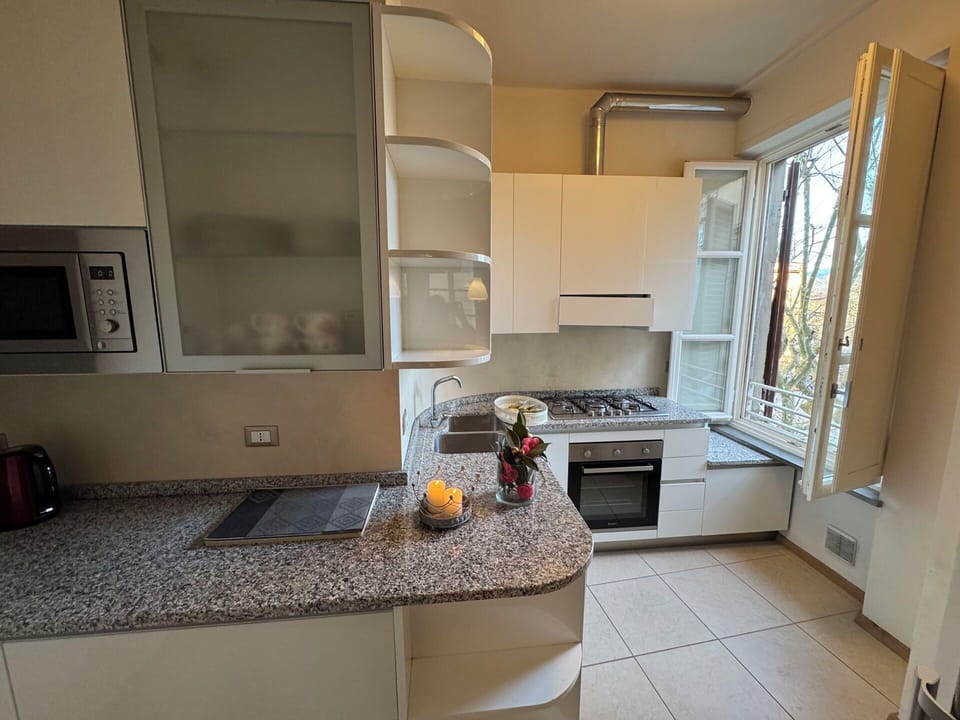 Kitchen, Kitchen Appliance, Countertop, Major Appliance, Flooring, Interior Design, Cabinetry, Home Appliance, Floor, Lighting
