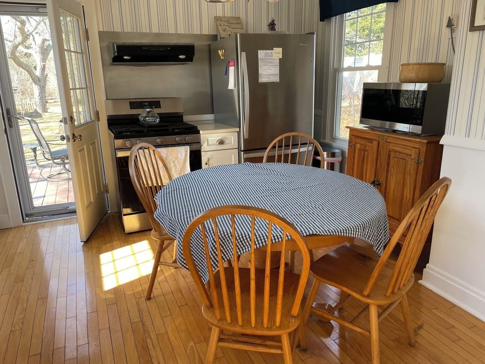 Kitchen Table and Stainless Steel Appliances