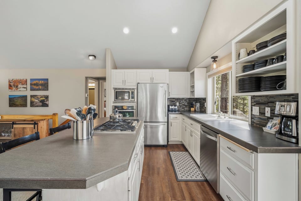 Your fully equipped kitchen invites culinary adventures with stainless appliances, granite counters, and everything needed for memorable meals together.