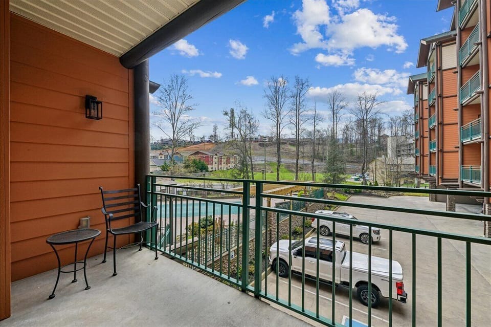 Step onto your private balcony and breathe in the fresh mountain air while enjoying peaceful views of the surrounding landscape and convenient parking below.