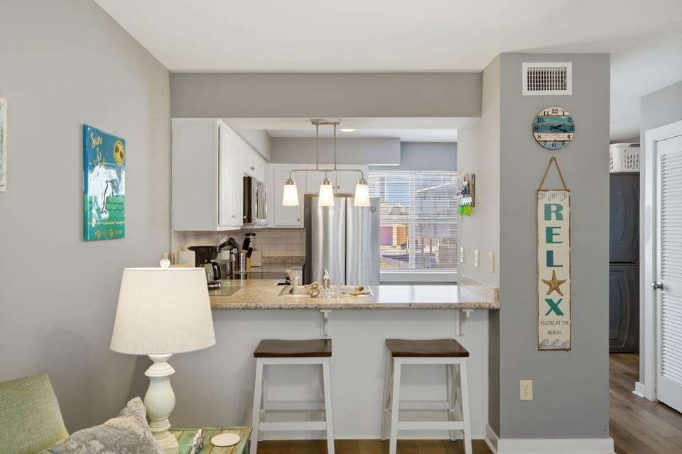 Pull up a stool—this is where snacks disappear and stories get better after every drink.