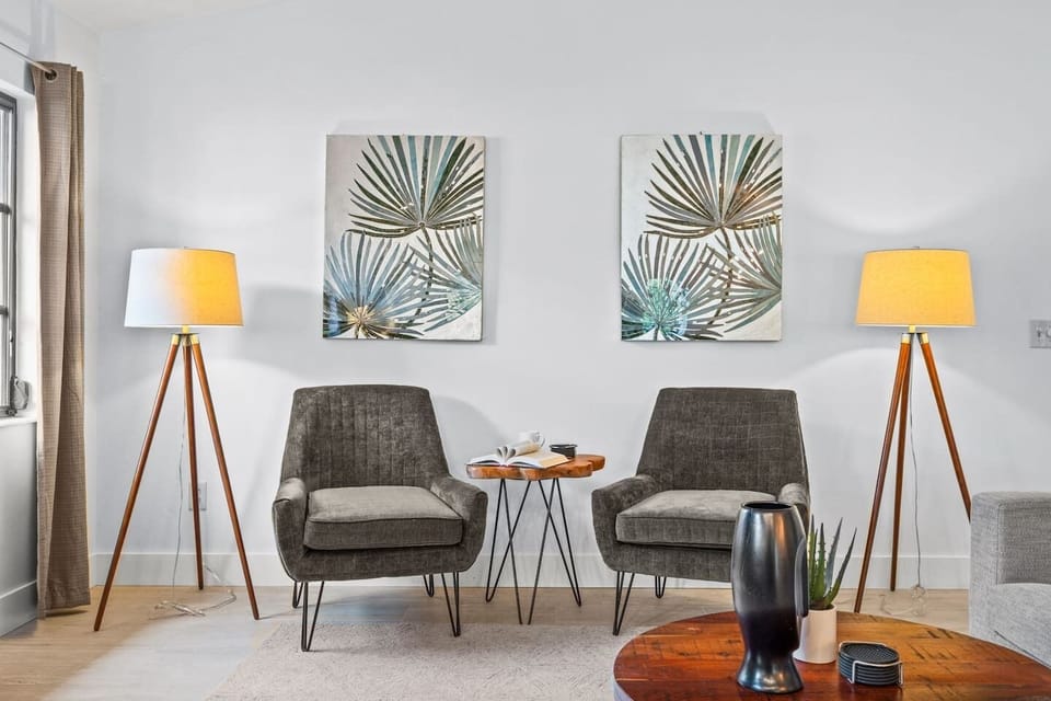 Your personal reading retreat! Comfy seating and thoughtfully placed lighting make this corner ideal for diving into a favorite story or simply relaxing.