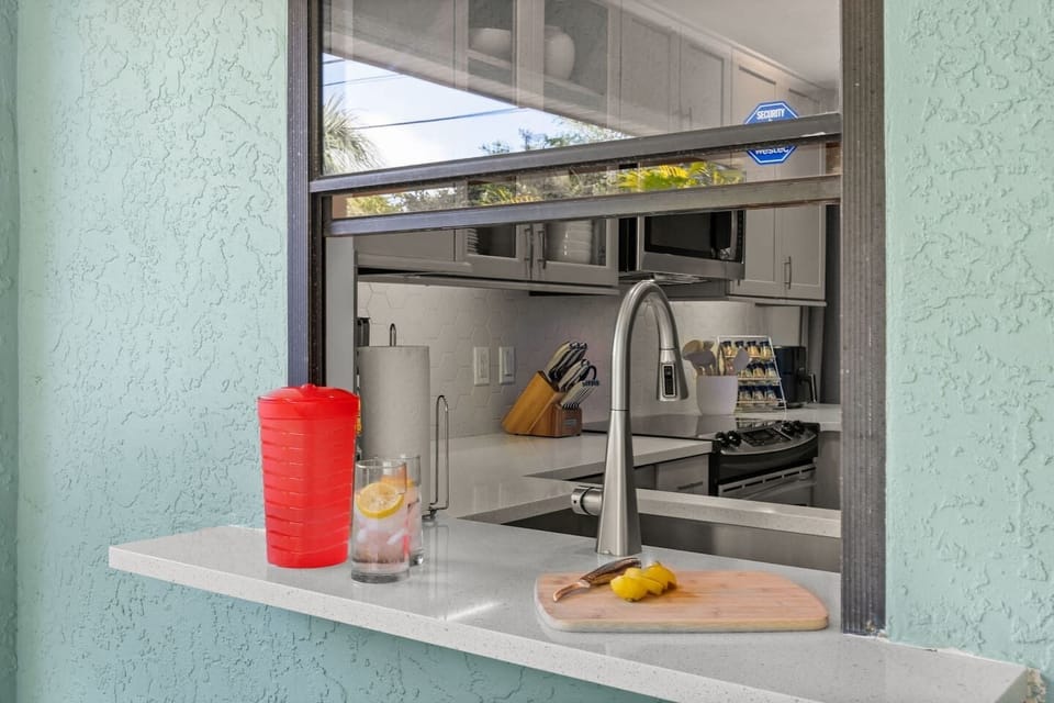 From kitchen to lanai in a flash! Use the pass-through window to keep drinks and snacks flowing without missing a moment of relaxation.