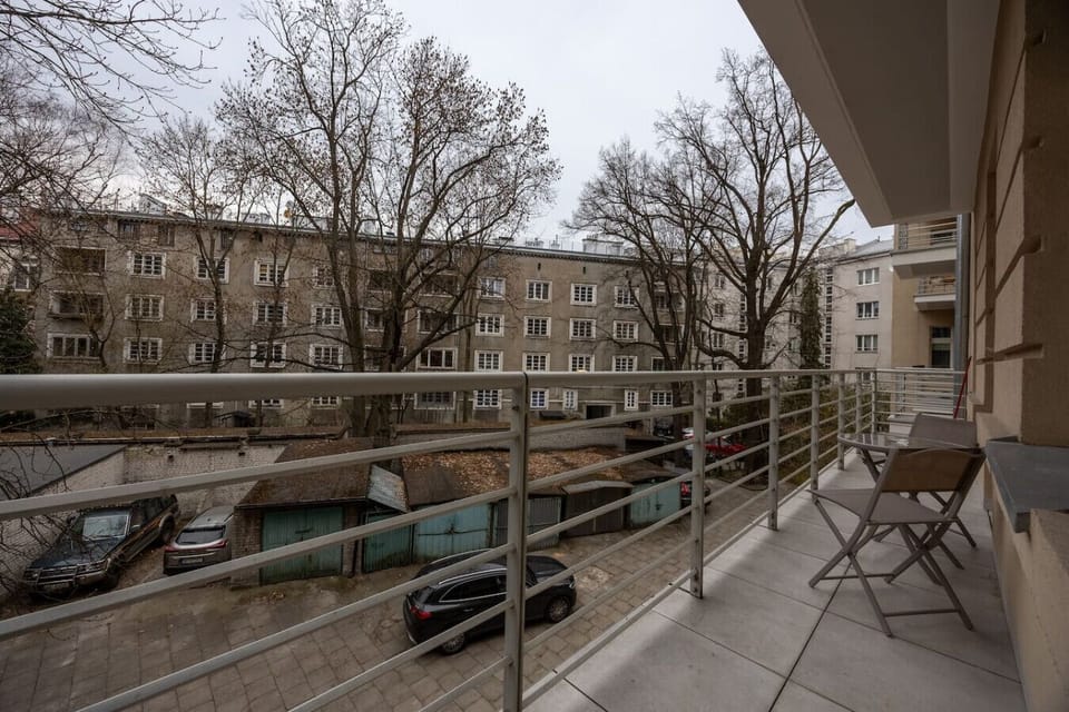 Private Balcony with Seating and Peaceful Courtyard View | Book Now with RENTUJEMY.COM
