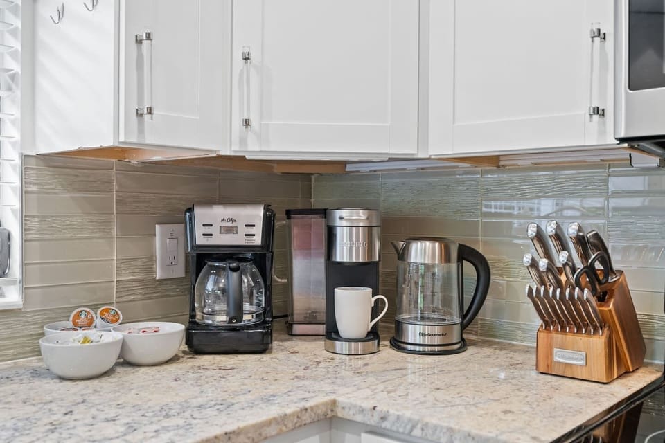 Start your morning just the way you like it—coffee from the Keurig or drip, or tea brewed with the electric kettle (yes, there’s even a proper teapot). Quality knives and multiple cutting boards make breakfast prep easy and enjoyable.