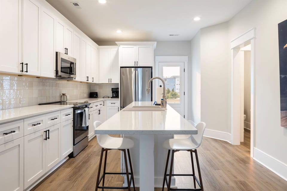 Full sized and well stocked kitchen with stainless steel appliances