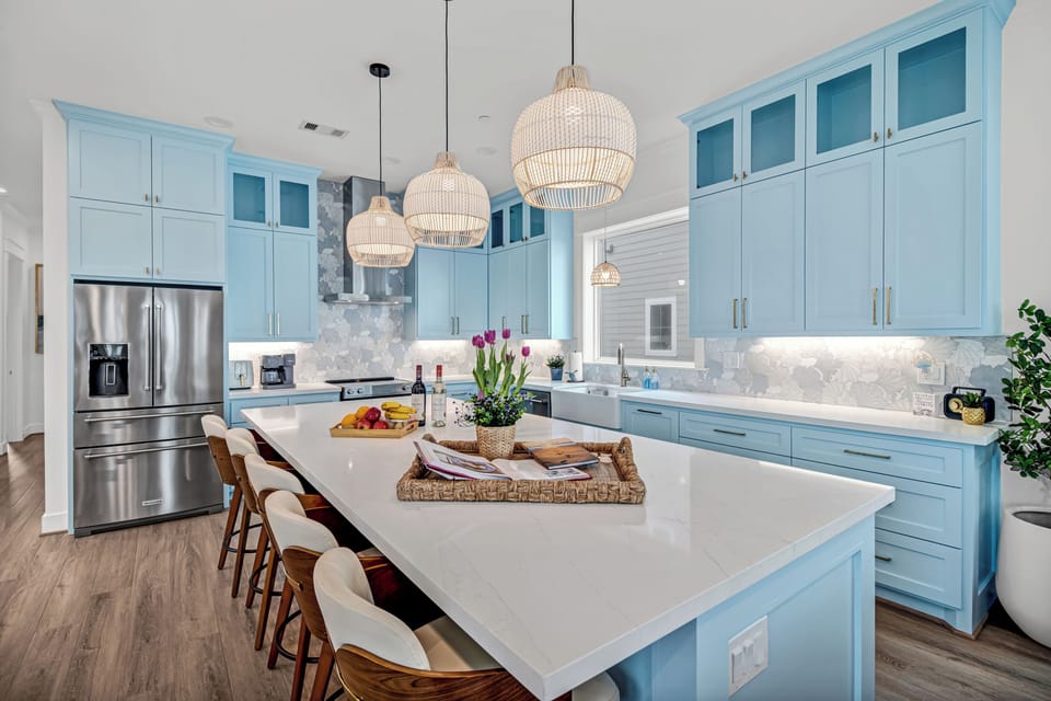 Fully stocked kitchen with high-end stainless steel appliances.