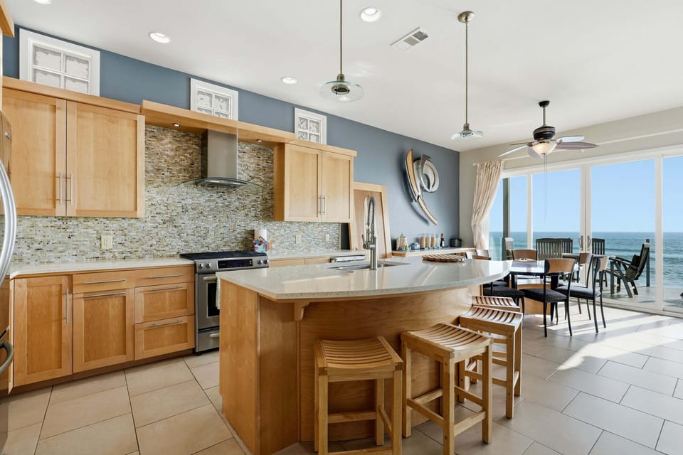 Open-concept kitchen and dining with ocean views