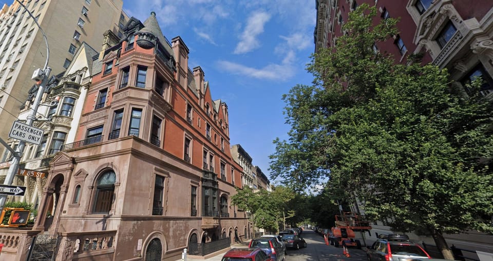 Tree-lined street half a block from Central Park