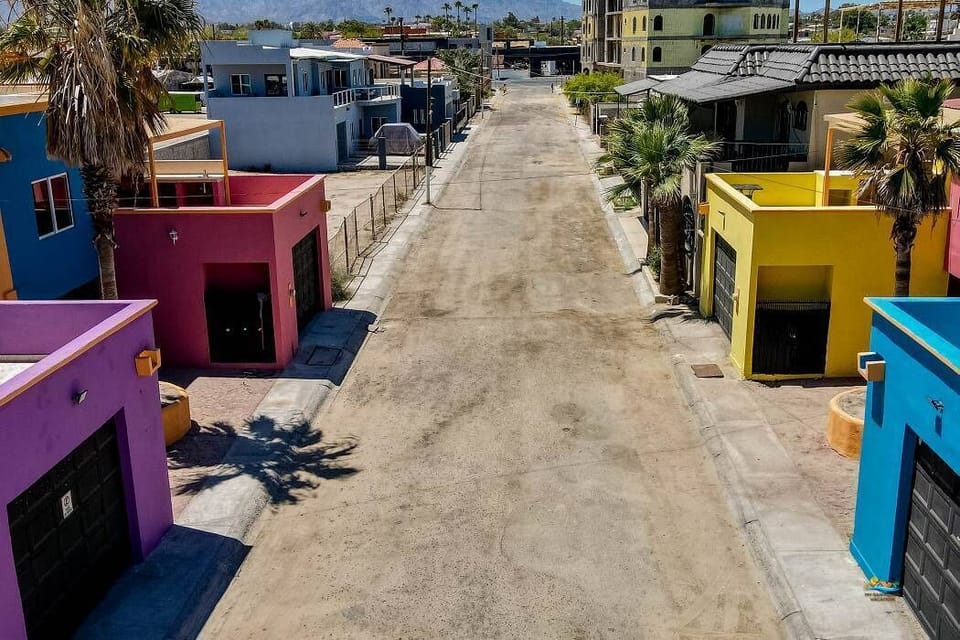 This aerial shot shows the condo's location at the end of a private road — directly across from the beach and just 2 blocks from the Malecon .