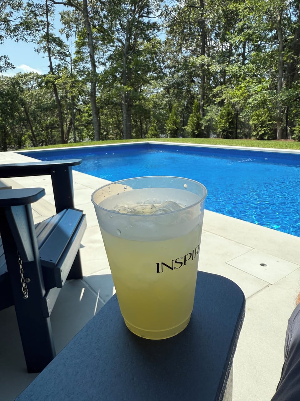 Private salt water pool with sun chairs and dining table 
