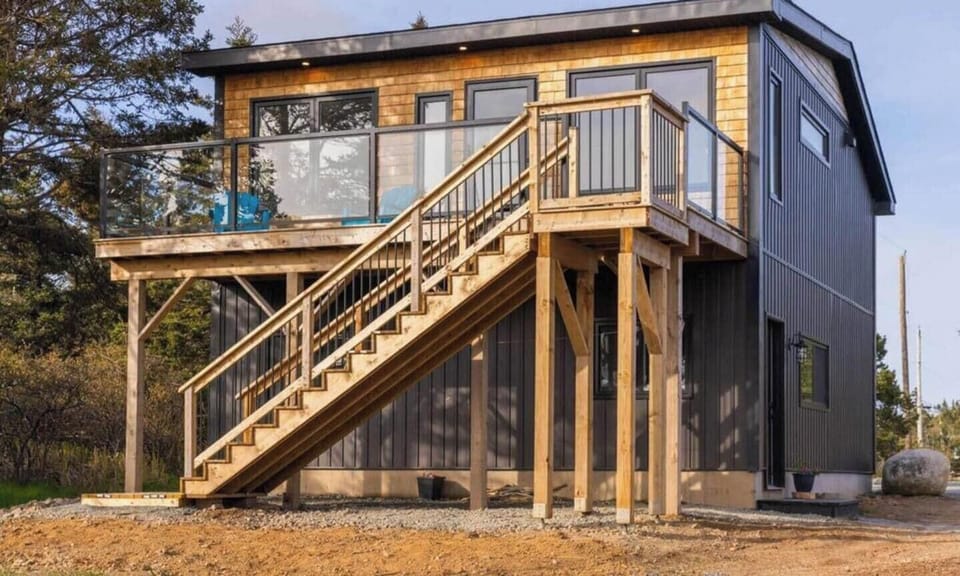 Our 1 Bedroom, 1 bath beach house suite is separate from our house and features a full kitchen and a breathtaking view of ocean sound & Petpeswick Inlet.