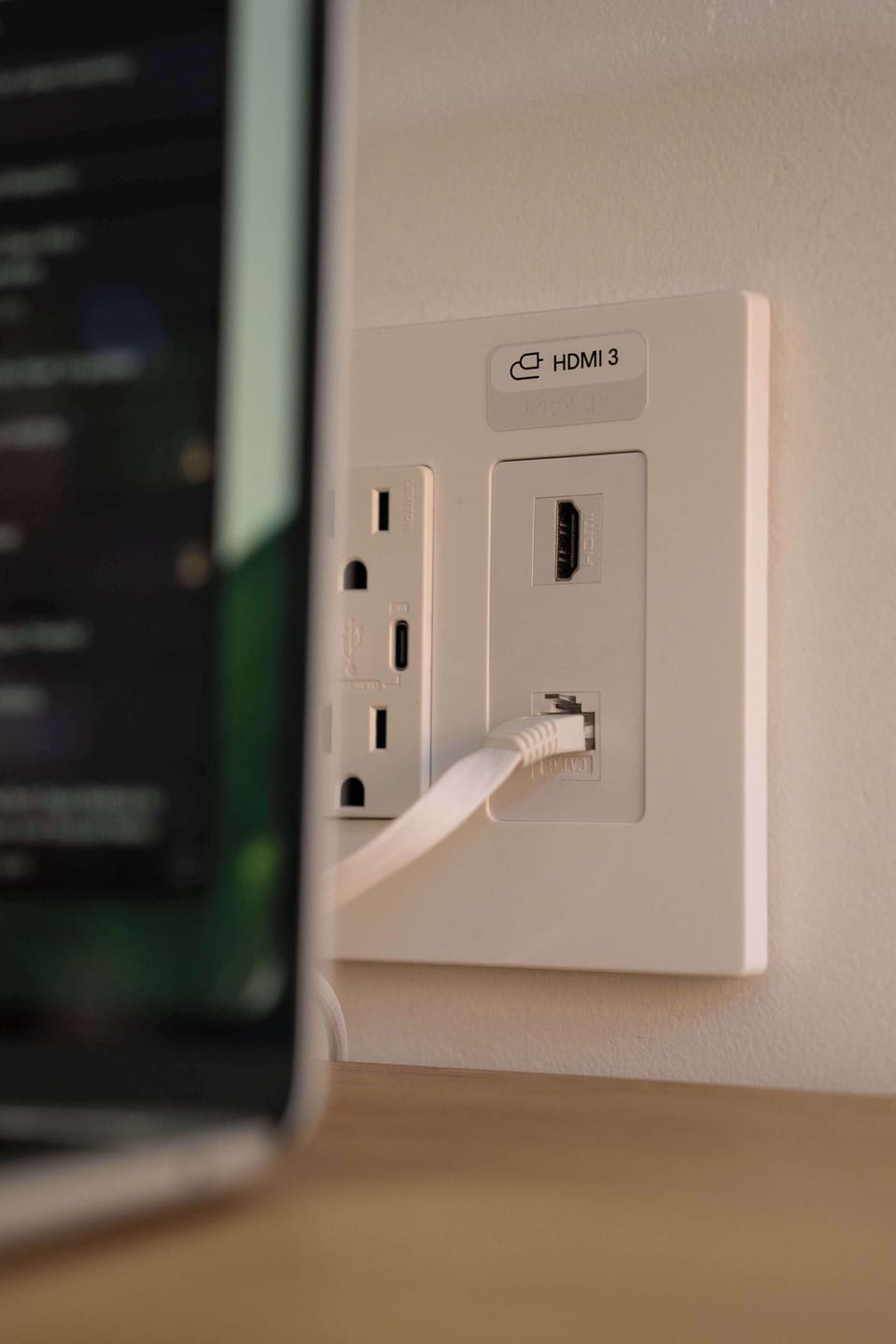 Use the TV as a second monitor via wall-mounted HDMI, plus wired ethernet for fiber-speed internet.