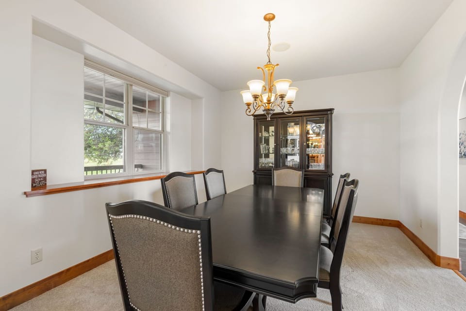 Elegant formal dining room with chandelier and seating for six