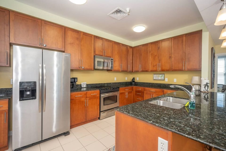 Spacious, fully equipped kitchen with stainless steel appliances and plenty of counter space—perfect for cooking and gathering.