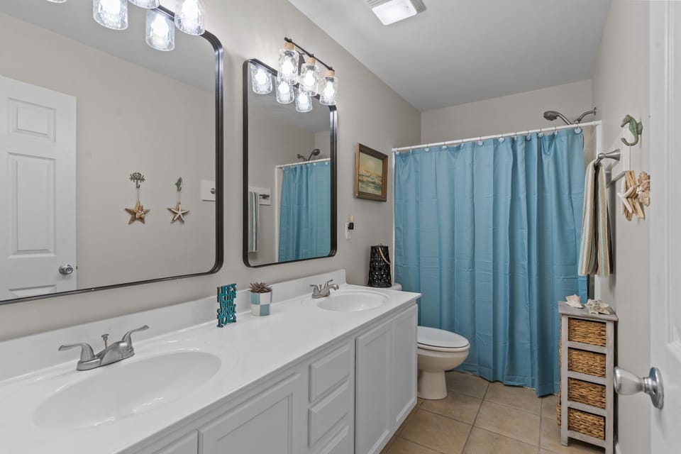 “Updated full bathroom with bright finishes”