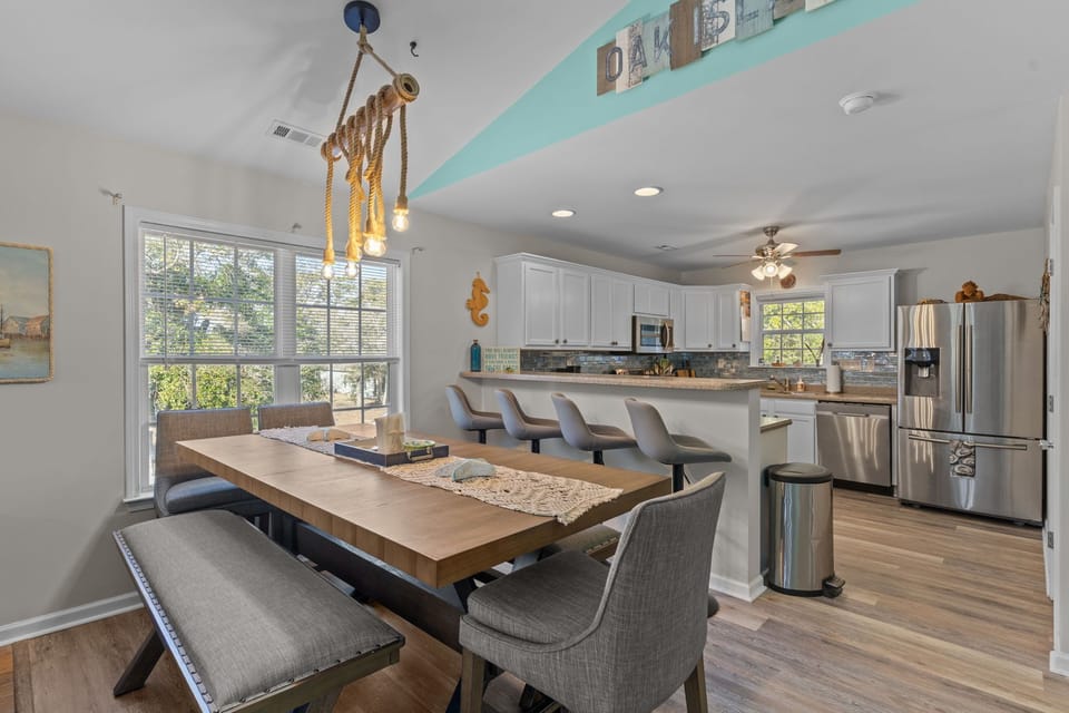 “Open‑concept living and dining space in renovated beach house”