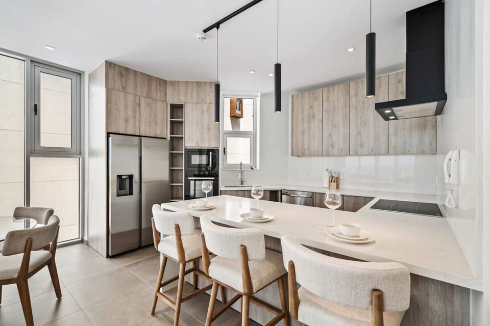 Modern Aruba kitchen with island seating fully equipped for cooking