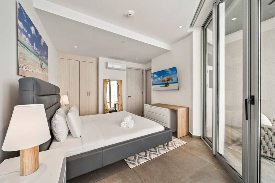 Spacious bedroom with plush bed and modern design