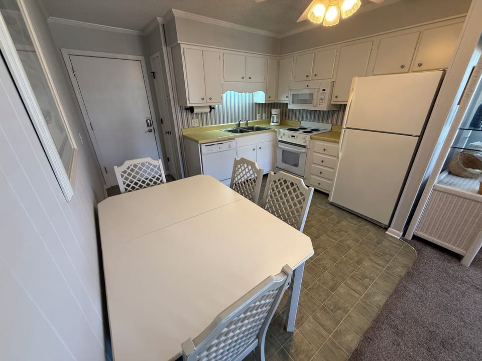 Additional chairs and table leaf available. 