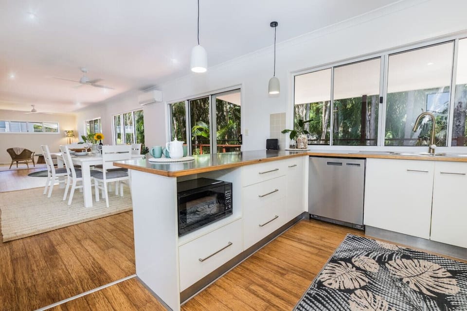 Spacious kitchen with modern appliances and adjoining dining area—perfect for family meals and entertaining.