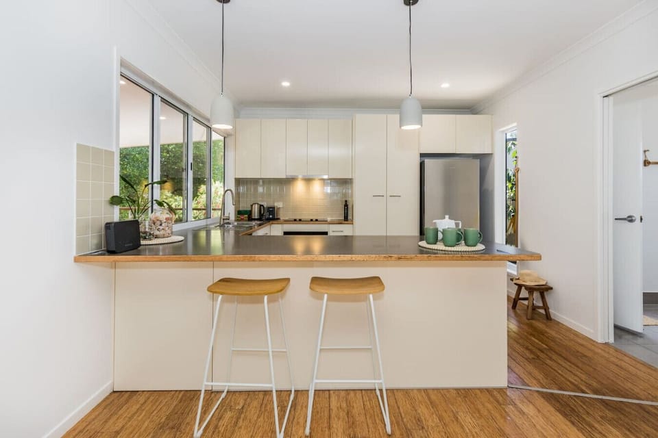Spacious kitchen with island seating, modern appliances, and plenty of counter space—ideal for family meals.