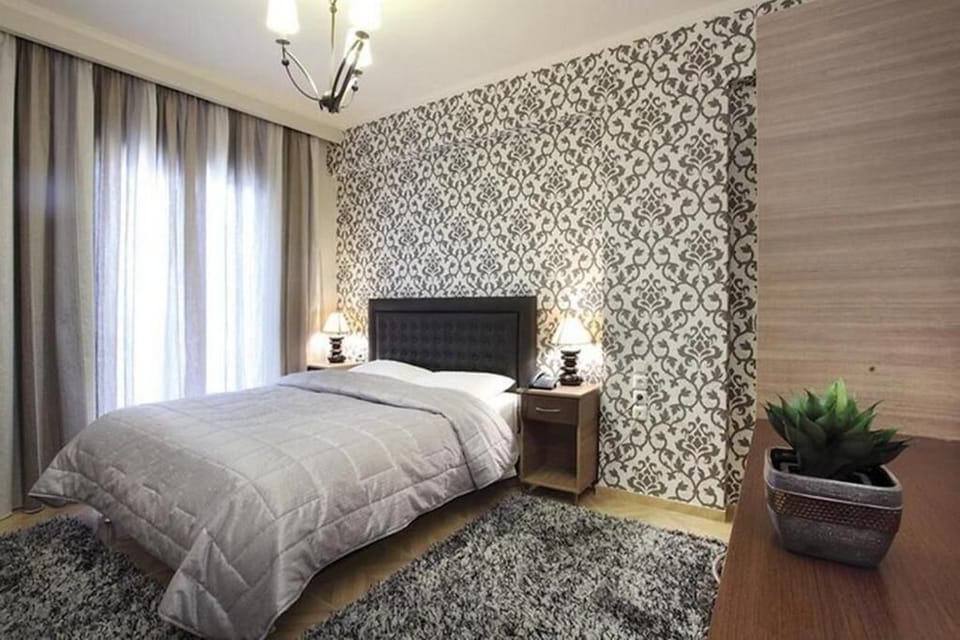 Stylish Double Bedroom with Feature Wall and Natural Light