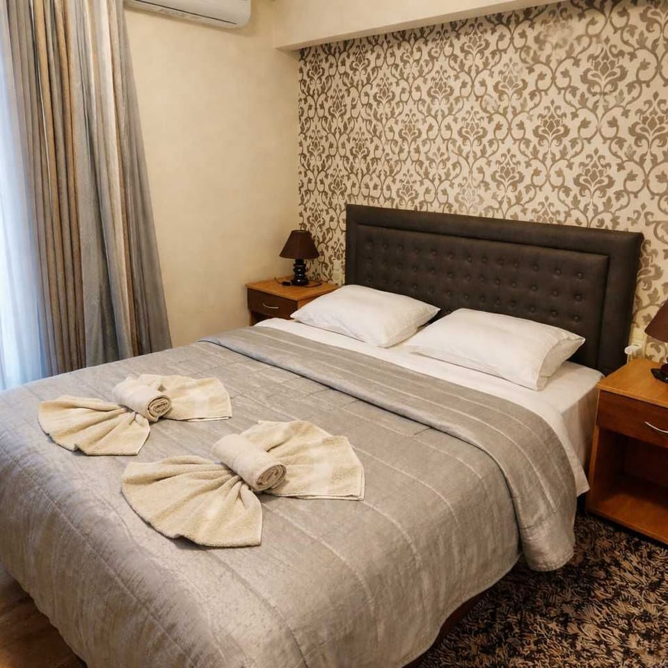 Comfortable Double Bedroom with Neutral Decor and Soft Textiles