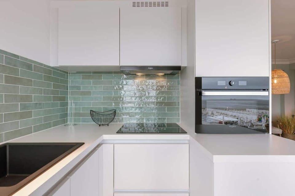 Stylish Kitchen with Green Tile Backsplash
